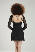 Dress with a slit at the back and long sleeves