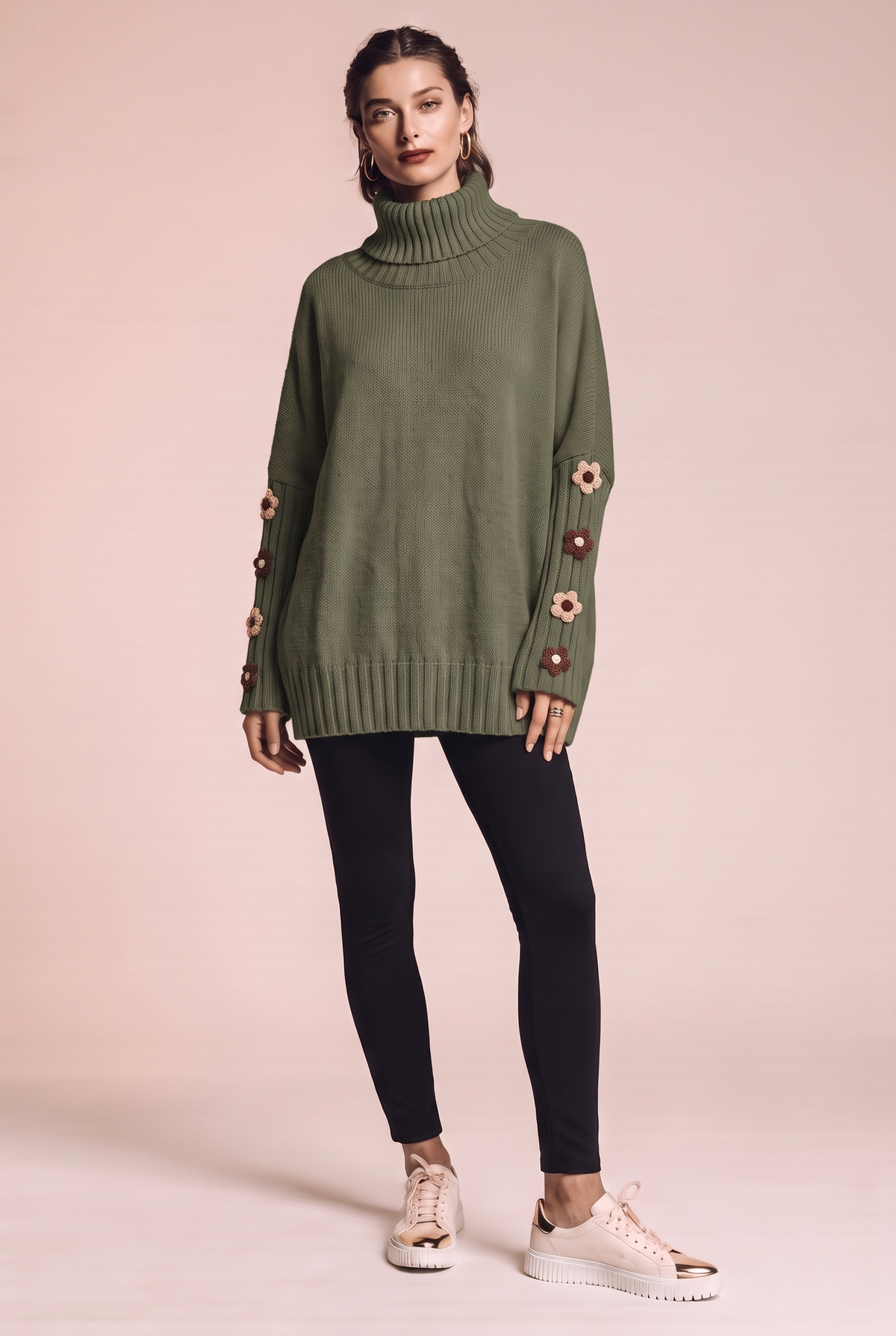 Dzianinowy sweter oversize z kwiatowymi naszyciami na rękawach