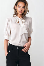 Elegant ecru blouse with a tie at the neckline B170 Ecru - Nife