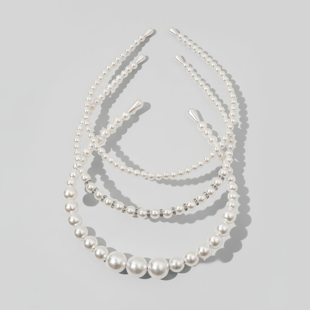 Zestaw trzech perłowych opasek do włosów