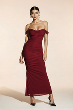 Model in dark red ruched maxi dress